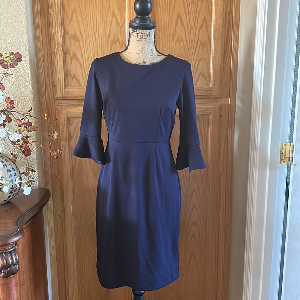 Gently used navy blue dress, with trumpet\bell sleeves. In decent condition